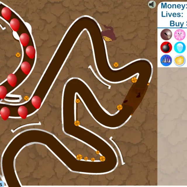 Bloons Tower Defense 3 brown cracked-earth track with red bloons on the path and a dart monkey beside it